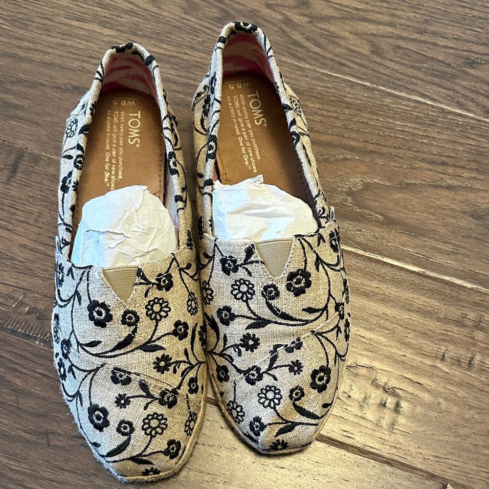 TOMS Black Floral Canvas Slip-Ons